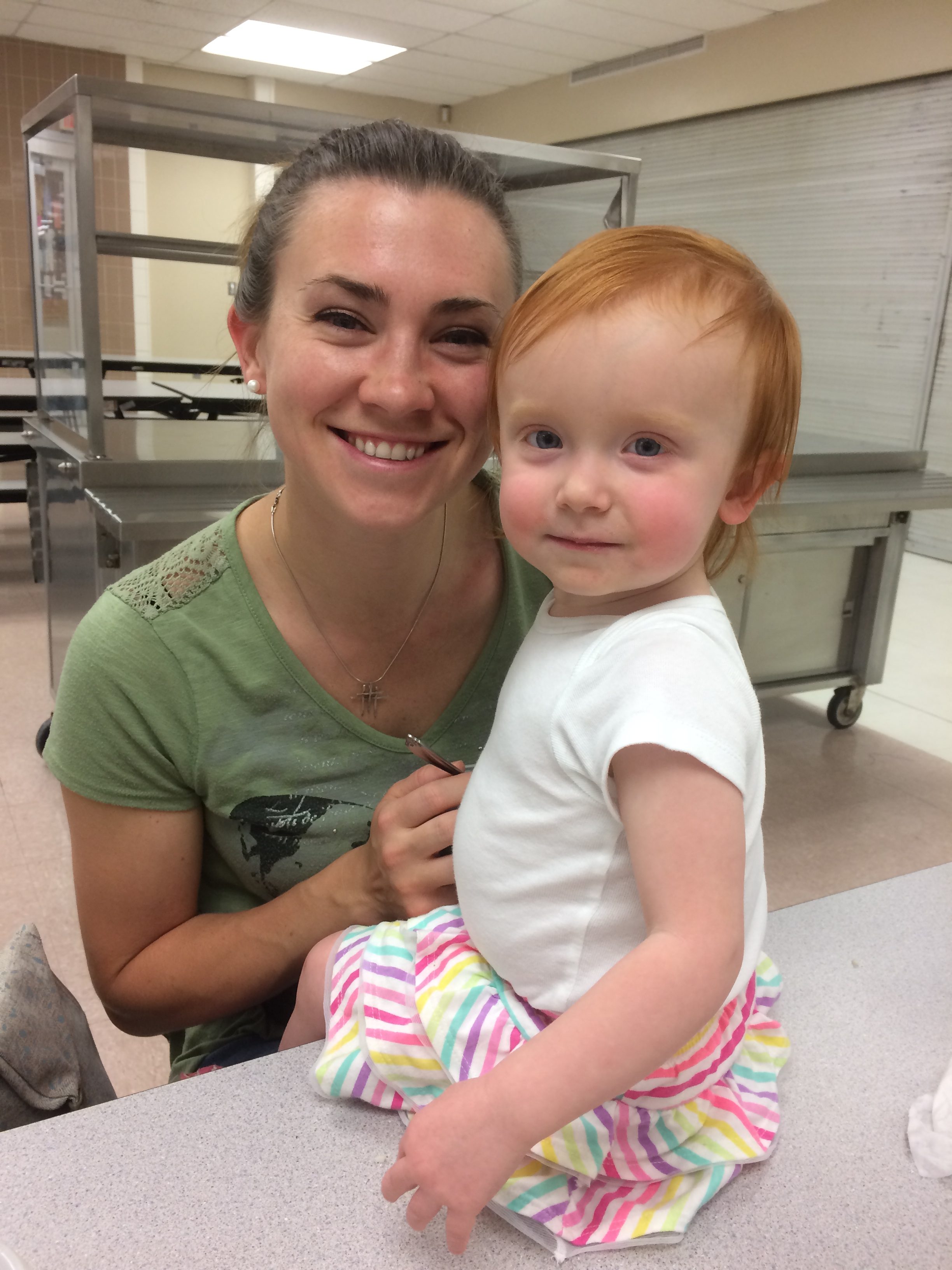 Photo of Presenter Blair Buselli’s wife and child, Aurora and Ella, at the SEEDS DIY Solar Installation workshop.