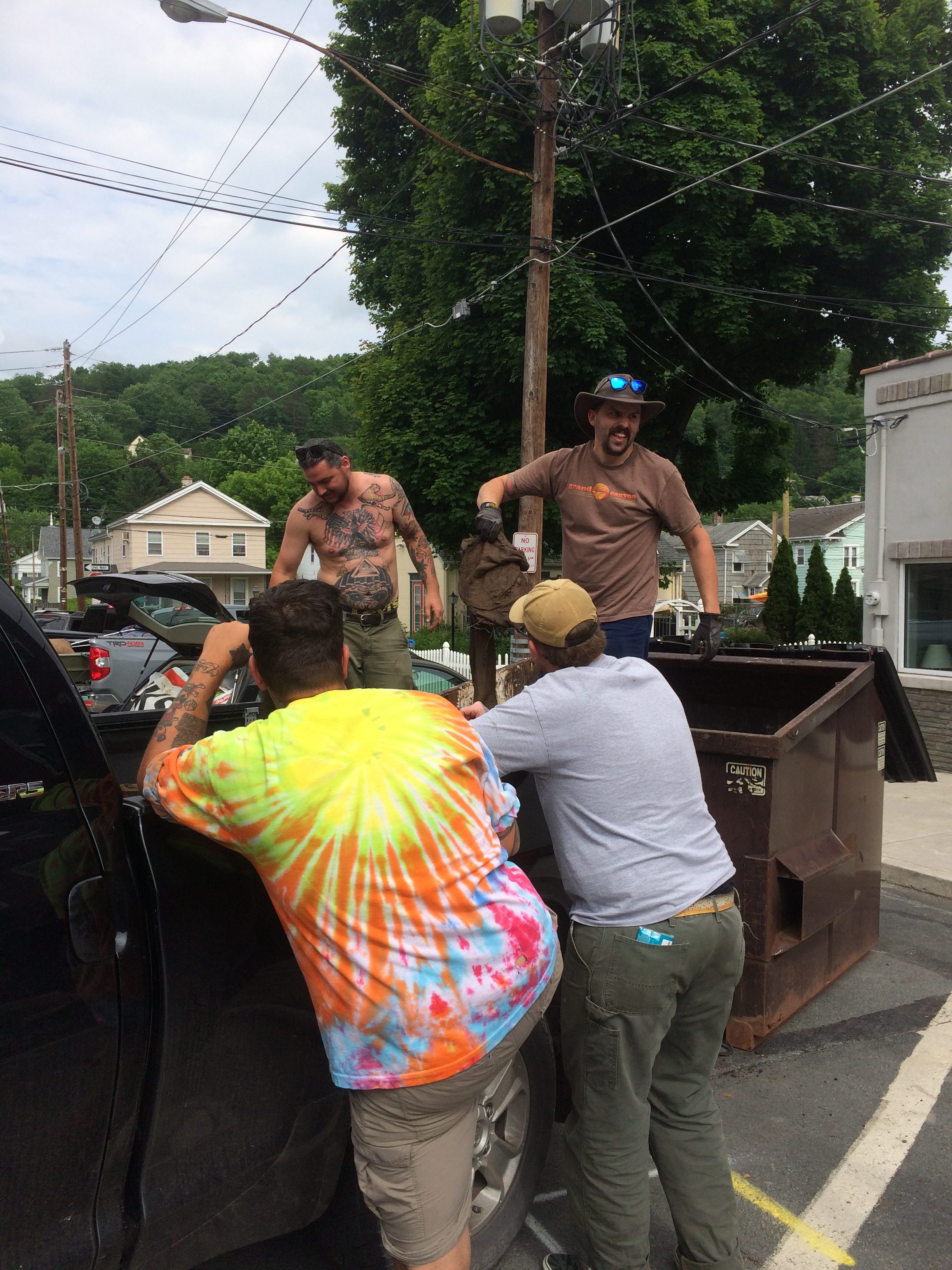 Photo of volunteers filling dumpsters at the Lackawaxen River Clean Up.